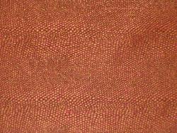 Pattern Animal color Sienna snake skin like textured design  in crimson red and gold upholstery fabric