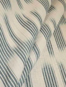 Draped curtain image of genuine hand dyed space-dyed yarns, made in India, Ikat pattern, with vertical textured striations, suitable for curtains, pillows, bedding and Decorator