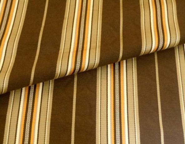 Closeup folded image of cotton woven jacquard, stripe pattern, for furniture upholstering and home decor, in our Erie islands Design with the Basics Collection