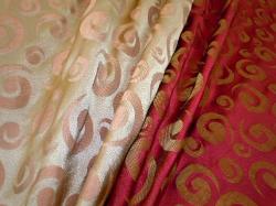 Draped curtain image of Closeout pattern Maya colors Coral or Wine Drapery and multipurpose home decor fabric, from World Wide Fabrics