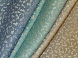 Cosmo Upholstery Fabric in colors river, seafrost or half moon