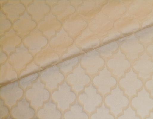 Closeup folded image of durable polyester cotton for home decor and decorating accents, a textured diamond tone on tone grid pattern 