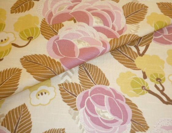 Closeup folded image of Deco Diva Color Dusk,  Colors include dusty orchid, gold, taupe, ochre, ivory, brown and citrine on a tan background