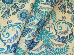 a vintage floral medallion design, Colors include shades of blue on an off-white background
