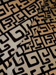 Greek Maze Geometric Design Upholstery Fabric color Black on Tan draped