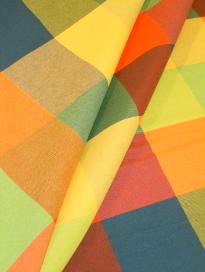 Draped curtain image of Hopi Color Lime woven decorating fabric with bright colored large check design