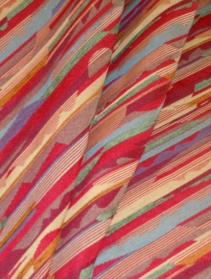 Draped curtain image of striped upholstery fabric pattern Montenegro Red