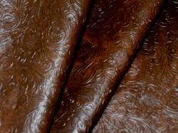 Embossed Faux Tooled Leather vinyl upholstery fabric heavily textured in a deep tobacco brown