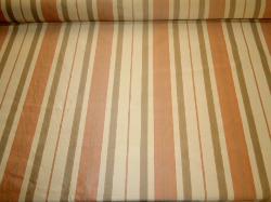 Orange Sherbert Stripe Upholstery Fabric on cutting table