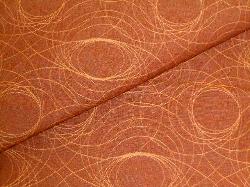 Closeup folded image of swirl decorating and upholstery fabric pattern Reporter Auburn