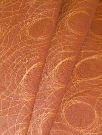 Draped curtain image of Pattern Reporter Color Auburn woven decorating and upholstery fabric