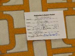 upscale premium high end modern intervoven chain link pattern heavy upholstery fabric, orange gold on off white