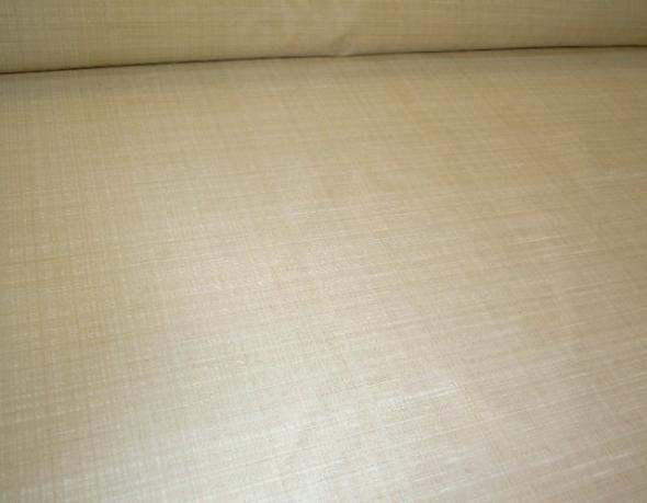 Angled image of Softline's Pattern Summit in Color Natural Solid-color in a rich grass cloth-like texture Drapery and Curtain Fabric