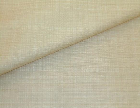 Closeup folded image of rich grass cloth-like texture Drapery and Curtain Fabric in Natural