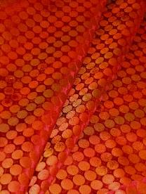 Draped curtain image of polka dot decorating fabric pattern Sunspot Flame