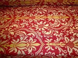 Pattern Tantalor color Paprika railroaded woven floral medallion damask design on cutting table