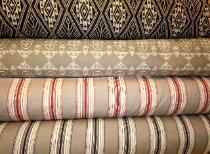 Rolls of New Laura & Kiran designer fabrics in stock